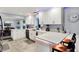 Beautifully renovated kitchen with modern lighting, quartz countertops, ample counter space and a casual dining area at 6820 W Forest Brook Dr, Fountaintown, IN 46130