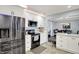 Well-designed kitchen with stainless steel appliances, sleek black oven range and microwave, and white shaker-style cabinetry at 6820 W Forest Brook Dr, Fountaintown, IN 46130