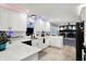 Charming kitchen featuring quartz counters and modern appliances with an easy view to the living room at 6820 W Forest Brook Dr, Fountaintown, IN 46130