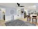 Stylish living room with modern decor, open layout, ceiling fan, and view into the kitchen at 6820 W Forest Brook Dr, Fountaintown, IN 46130