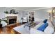 Comfortable living room featuring a fireplace, hardwood floors, stylish furniture, and neutral paint at 6820 W Forest Brook Dr, Fountaintown, IN 46130