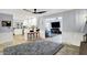 Open-concept area shows a spacious living room leading to a kitchen with bar-style seating at 6820 W Forest Brook Dr, Fountaintown, IN 46130