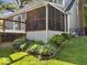 Enclosed screened in porch, perfect for enjoying the outdoors, adjoins an outdoor deck, and landscaped yard at 6820 W Forest Brook Dr, Fountaintown, IN 46130