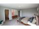 A bedroom showcasing a bed, modern decor, and access to an ensuite bathroom at 735 Locust Dr, Danville, IN 46122