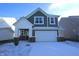 Beautiful two-story home with a two-car garage, covered porch and traditional design elements at 735 Locust Dr, Danville, IN 46122