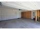 Large, unfinished garage with concrete floors and a mix of finished and exposed framing at 735 Locust Dr, Danville, IN 46122