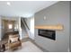 Living room with a modern fireplace and staircase at 735 Locust Dr, Danville, IN 46122