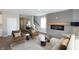 This stylish living room features a modern fireplace, neutral decor, and a cozy seating arrangement at 735 Locust Dr, Danville, IN 46122