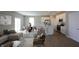 Open-concept living space combines the living room, dining area, and a kitchen with stainless steel appliances at 735 Locust Dr, Danville, IN 46122