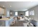Bright open-concept living area with a modern kitchen, dining area, and a comfortable living room at 735 Locust Dr, Danville, IN 46122