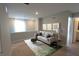 Bright sitting area with a comfortable couch, stylish decor, and lots of natural light at 735 Locust Dr, Danville, IN 46122