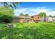 A well-manicured backyard includes a fire pit and lawn furniture at 8315 San Marcos Cir, Indianapolis, IN 46256
