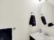 Half bathroom includes a circular mirror and stylish towel rack at 8315 San Marcos Cir, Indianapolis, IN 46256