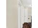 Hallway features hardwood floors, neutral walls and white doors at 8315 San Marcos Cir, Indianapolis, IN 46256