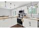 Modern kitchen with stainless steel appliances, stylish cabinets, butcher block countertop, and natural light from the window at 8315 San Marcos Cir, Indianapolis, IN 46256