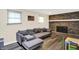 Cozy living room with a brick fireplace and comfortable seating at 8315 San Marcos Cir, Indianapolis, IN 46256