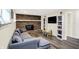 Inviting living room features a brick fireplace and television at 8315 San Marcos Cir, Indianapolis, IN 46256