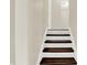 Clean, freshly painted staircase with wood treads and white risers leading to the upper level of the home at 8315 San Marcos Cir, Indianapolis, IN 46256