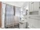 Small bathroom with vanity, sink, and a shower with curtain at 8606 Manderley Dr, Indianapolis, IN 46240
