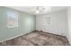 Bedroom featuring two windows and carpeted floors at 8606 Manderley Dr, Indianapolis, IN 46240
