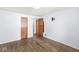 Bedroom featuring hardwood floors and several doorways at 8606 Manderley Dr, Indianapolis, IN 46240