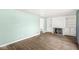Spacious living room featuring hardwood floors and a cozy fireplace with built-in shelving at 8606 Manderley Dr, Indianapolis, IN 46240