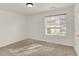 Well-lit bedroom featuring neutral carpet, white walls, and a window with blinds at 8920 Hunters Creek Dr # 101, Indianapolis, IN 46227