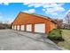 Detached garages with white doors that add extra parking for residents at 8920 Hunters Creek Dr # 101, Indianapolis, IN 46227