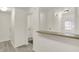 Bright hallway with neutral walls and flooring leading to other areas of the home at 8920 Hunters Creek Dr # 101, Indianapolis, IN 46227