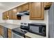 Updated kitchen with stainless steel appliances, wood cabinetry, and stylish countertops at 8920 Hunters Creek Dr # 101, Indianapolis, IN 46227