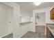 Clean, open concept kitchen flows into other living spaces, great for entertaining at 8920 Hunters Creek Dr # 101, Indianapolis, IN 46227