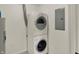 Efficient laundry area with stacked washer and dryer for space-saving convenience at 8920 Hunters Creek Dr # 101, Indianapolis, IN 46227