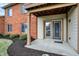 Private patio area with sliding glass doors and tasteful landscaping at 8920 Hunters Creek Dr # 101, Indianapolis, IN 46227