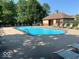 Community pool with lounge chairs for relaxing by the water at 8920 Hunters Creek Dr # 101, Indianapolis, IN 46227