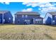 Large backyard featuring well-kept lawn, neighboring houses, and a patio at 950 Edmonds Pl, Greenwood, IN 46143