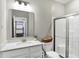 Bathroom features include a white vanity with solid surface countertop and tiled shower at 950 Edmonds Pl, Greenwood, IN 46143
