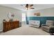 Cozy Bedroom with blue wainscoting, ceiling fan, and accent decorations at 950 Edmonds Pl, Greenwood, IN 46143