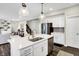 Modern kitchen with stainless steel appliances, white cabinets, and center island with sink at 950 Edmonds Pl, Greenwood, IN 46143