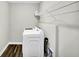 Laundry room with modern white appliances and white wire shelving at 950 Edmonds Pl, Greenwood, IN 46143