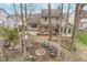 Aerial view of a backyard with a pergola-covered patio, fire pit, and seating area at 10937 Sawgrass Dr, Fishers, IN 46037