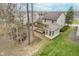 Aerial view of a backyard featuring a covered patio and sunroom addition at 10937 Sawgrass Dr, Fishers, IN 46037