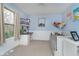 Bright bedroom with a twin bed, wainscoting, and a window providing natural light at 10937 Sawgrass Dr, Fishers, IN 46037