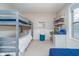 A cozy bedroom with a bunk bed and desk providing a great space for  at 10937 Sawgrass Dr, Fishers, IN 46037