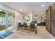 Open concept dining area with access to the living room and an outdoor patio with a hammock and outdoor furniture at 10937 Sawgrass Dr, Fishers, IN 46037