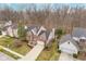 Aerial view of a two-story brick home with a well-maintained lawn and driveway at 10937 Sawgrass Dr, Fishers, IN 46037