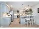 Modern kitchen featuring white cabinets, a breakfast bar, and stainless steel appliances at 10937 Sawgrass Dr, Fishers, IN 46037