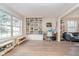 Spacious living room with hardwood floors, built-in shelving, and ample natural light at 10937 Sawgrass Dr, Fishers, IN 46037