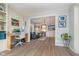 Open-concept living room flowing into a dining area, and hardwood flooring at 10937 Sawgrass Dr, Fishers, IN 46037