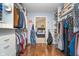 Spacious walk-in closet with custom shelving and hanging rods providing ample storage space at 10937 Sawgrass Dr, Fishers, IN 46037