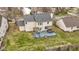 Overhead view of home features a backyard with deck, furniture, a hot tub, and outdoor barbeque at 11046 Timberview Dr, Fishers, IN 46037